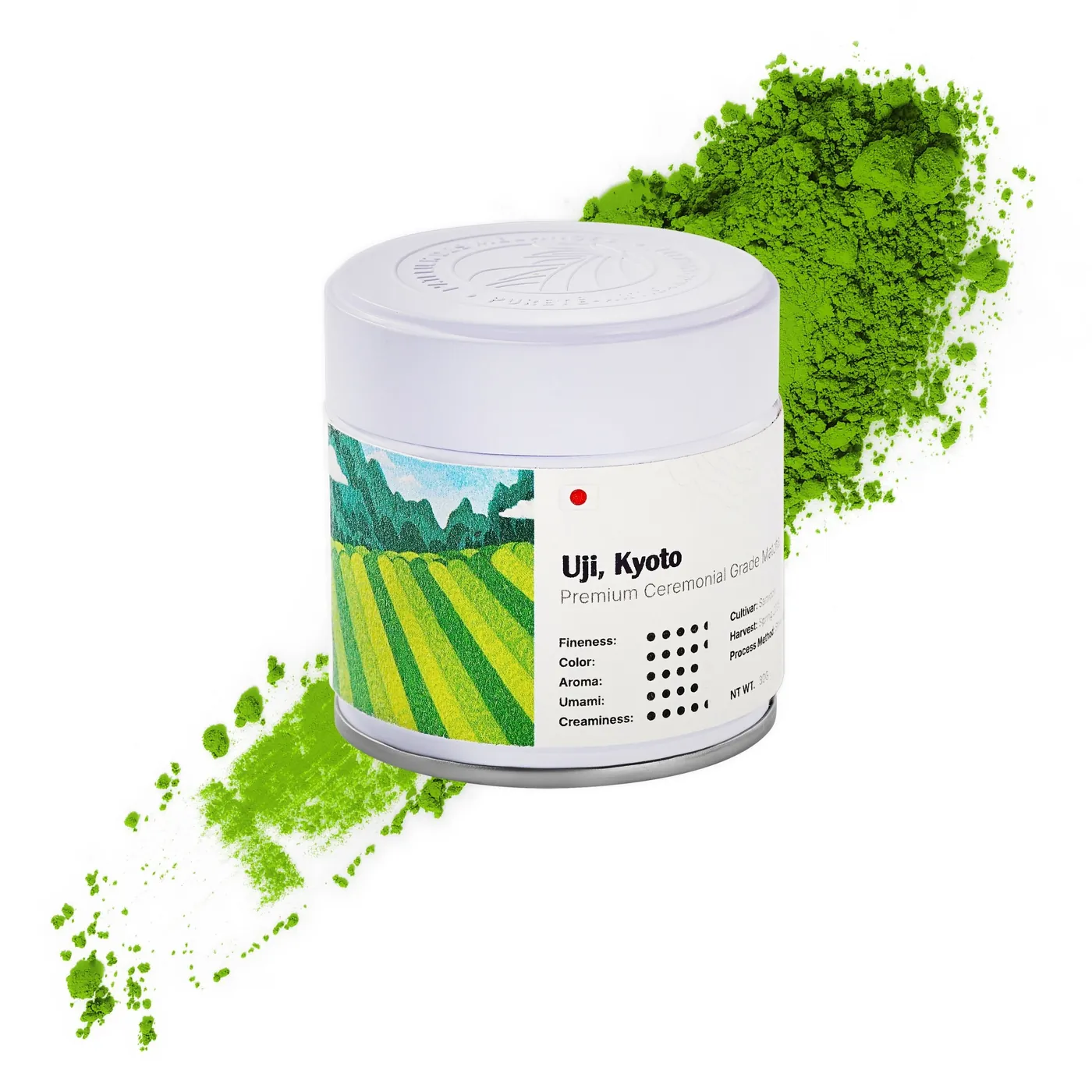 M'atelier matcha tin beside a spray of bright green matcha powder